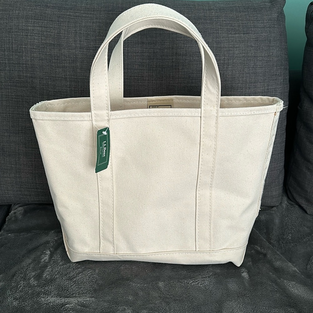 LL Bean canvas medium Boat and Tote.  
Dimensions: 12"H x 13"W x 6"D.